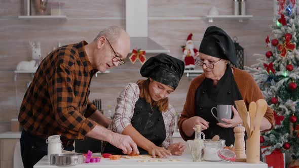 Happy Family Preparing Xmas Delicious Gingerbread Dessert Using Cookies Shape