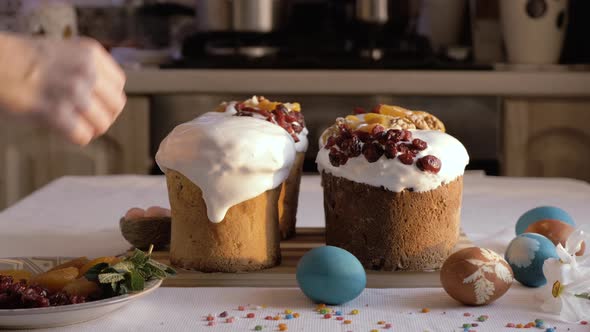 Preparing Easter cakes. Decoration sweet dry fruits. Happy Easter.