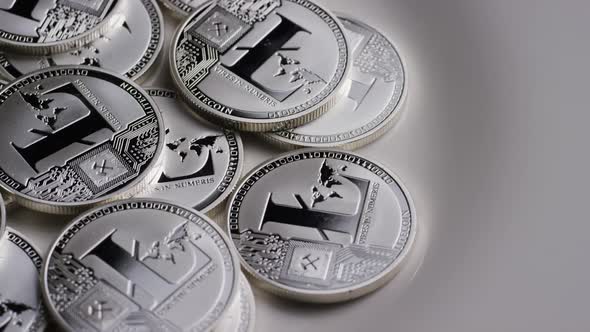 Rotating shot of Litecoin Bitcoins (digital cryptocurrency) - BITCOIN LITECOIN 0175