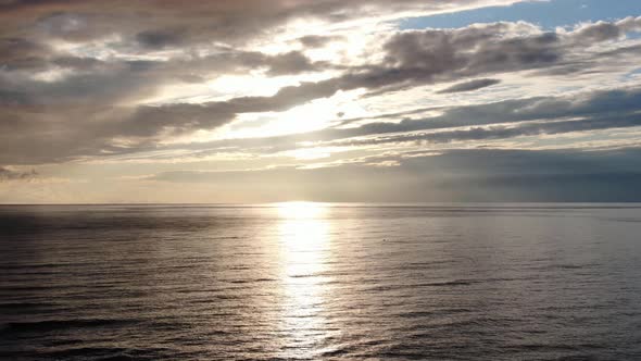 Sunset with Clouds Over the Beach