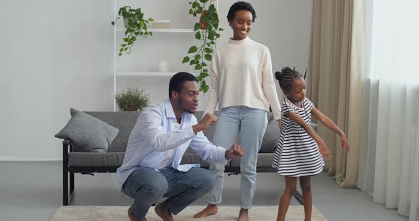 Three Afro Black Mixed Race People Young African American Family at Home Little Girl Daughter Child