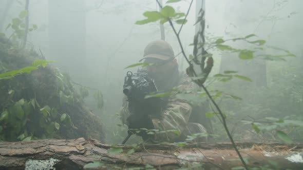 Gunner and Sniper with Weapon Sitting in Wait in Concealed Position