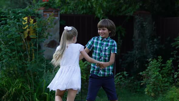 Friendly Cousins Playing Together, Hugging to Support Each Other, Childhood