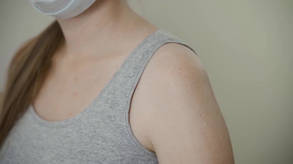 Young Asia Lady Nurse Giving Covid19 or Flu Antivirus Vaccine Shot to Senior Female Patient Wear