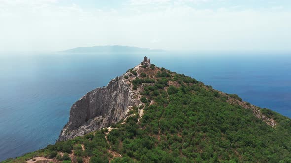 Aerial View of Ancient and Medieval Building on the Top of Mountainrocky Coastline with Green