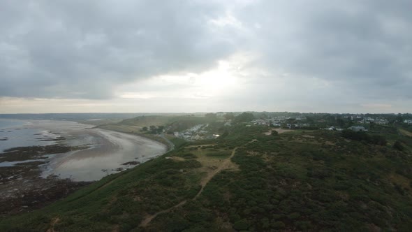 Drone aerial footage of the rocky cliffs of Beauport Beach in Jersey.