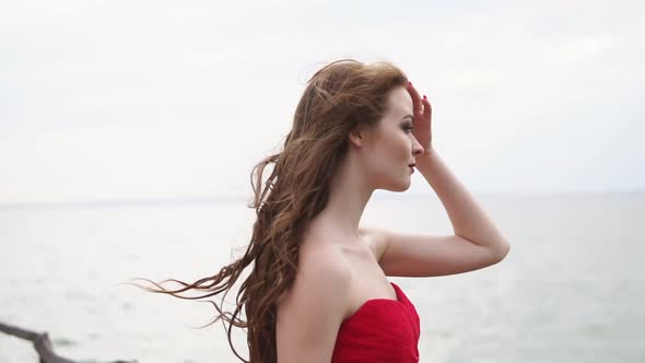 Woman Profile in Background of Sea in Windy Summer Day Closeup