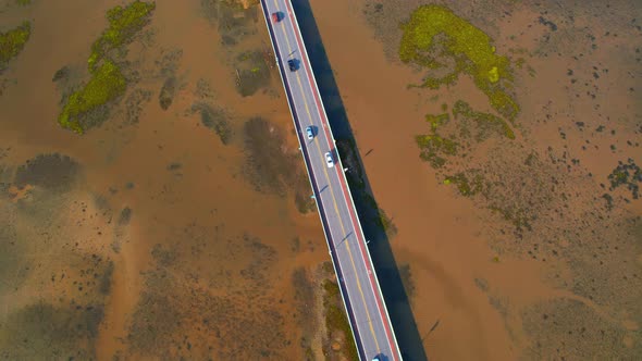 Drone video of the road leads through a large beautiful wetland.