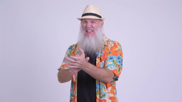 Happy Mature Bearded Tourist Man Clapping Hands