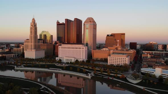 Columbus Ohio Skyline at dusk with the Scioto River in the foreground