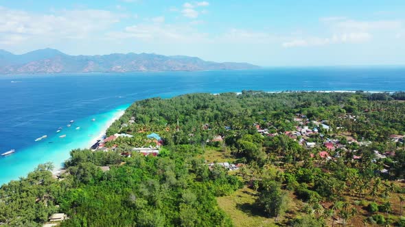 Aerial above seascape of relaxing shore beach time by blue green ocean with bright sand background o