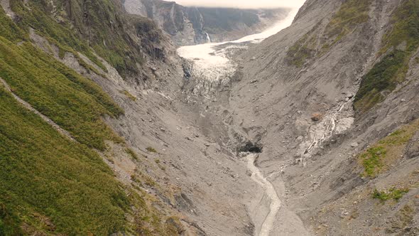 Aerial view of scenic Fox Glacier at the mountain range, New Zealand.