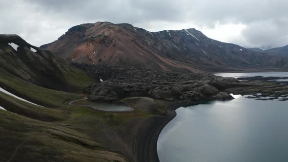 Drone View of Icelandic Countryside with Snow Capped High Mountains Peak