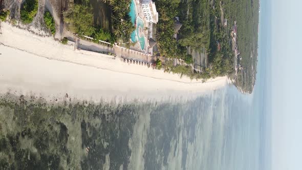 Vertical Video of the Ocean Near the Coast of Zanzibar Tanzania Aerial View