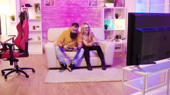 Bearded Boyfriend Playing Online Games with His Beautiful Blonde Girlfriend