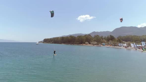 Aerial view of person kitesurfing in the Gulf of Patras, Greece.