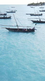 Vertical Video Boats in the Ocean Near the Coast of Zanzibar Tanzania