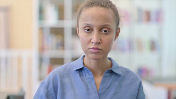 Portrait of Disappointed African Woman Doing Thumbs Down