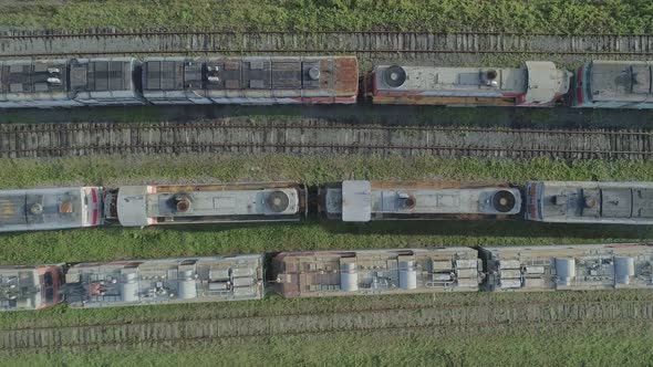 Aerial Top Down Shot of an Abandoned Rusty Locomotives and Old Railways