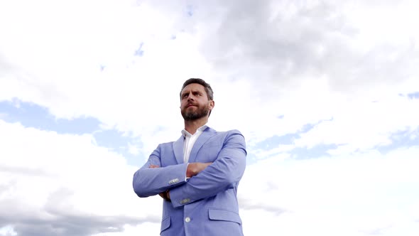 Confident Professional Lawyer in Formal Suit Keep Arms Crossed on Sky Confidence