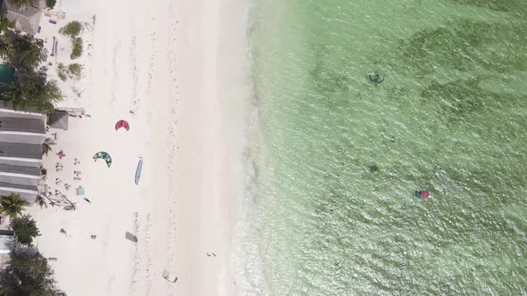 Zanzibar Tanzania  Vertical Video Kitesurfing Near the Shore of Ocean Slow Motion