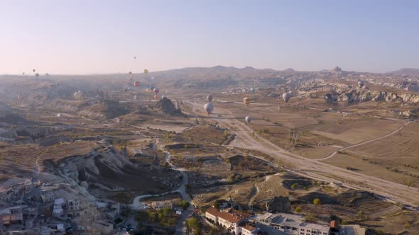 Cappadocia Landscape with Flying Hot Air Balloons.