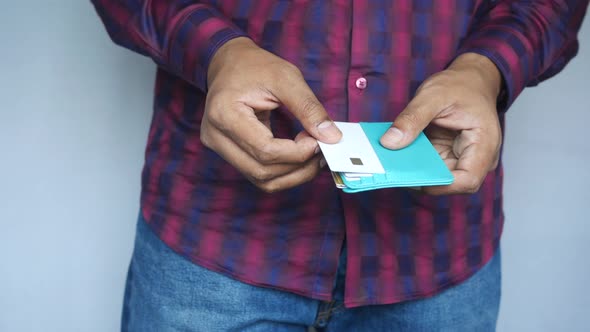 Man Hand Taking Credit Card Out From a Wallet