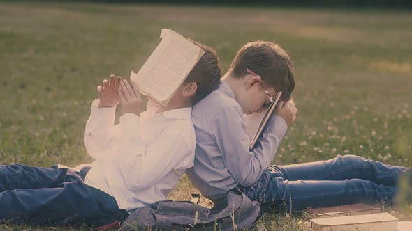 Sleeping Pupil Fixes Pen in Mouth Leaning on Schoolmate