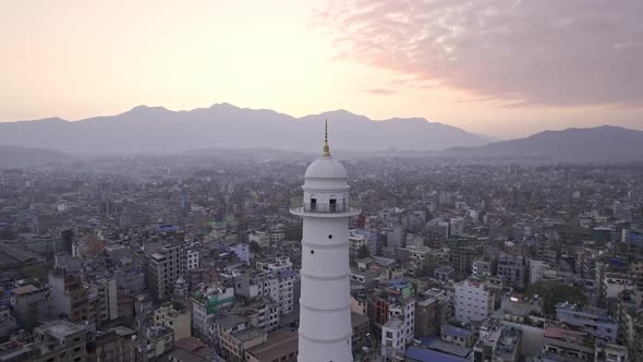 Sunset aerial view flying around the Dharahara Tower