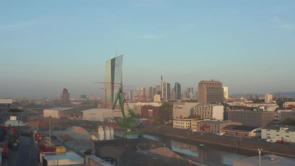 View on Frankfurt Am Main, Germany Skyline From Port Area with Cranes in Foreground, Slow Aerial