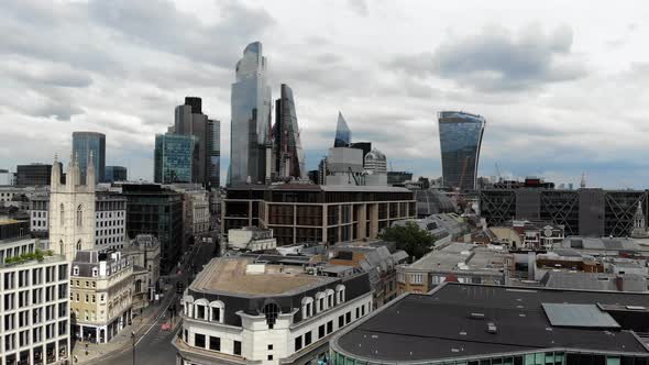 Smooth aerial view of the tall office buildings in the City of London Financial District