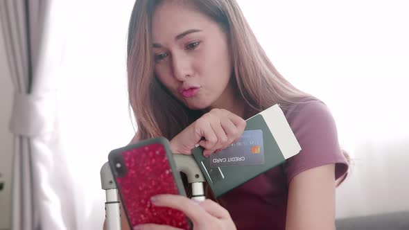 Woman happy selfie portrait with her passport and credit card before travel trip