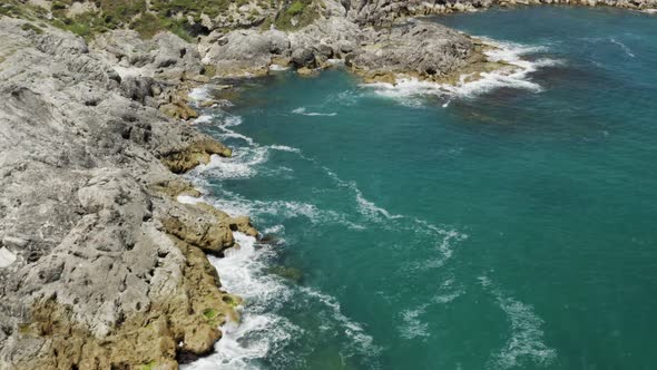 Clean Sea Waves And Rocks Aerial View