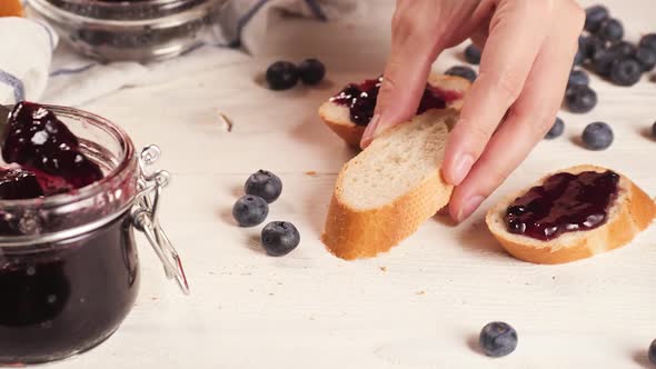 Crop Person Making Toasts with Jam