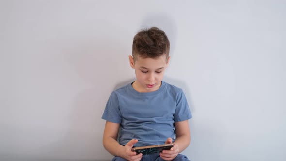 Child Playing Video Game at Home