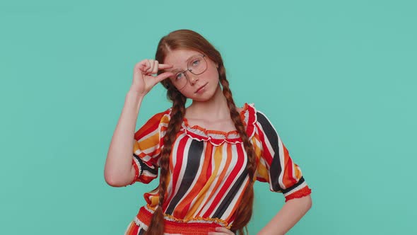 Girl Showing a Little Bit Gesture with Sceptic Smile Showing Minimum Sign Measuring Small Size