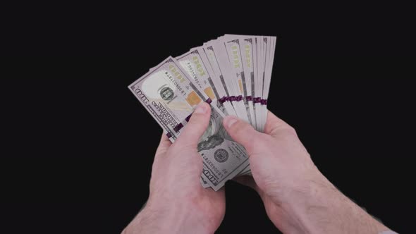 Male Hands Counting a Lot of 100 American Dollar Banknotes with Alpha Channel