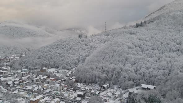 Krasnaya Polyana Village Surrounded By Mountains Covered with Snow