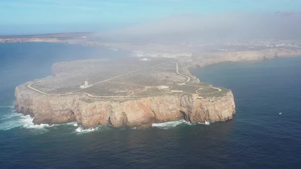 Cape Sagres Fortress in the southwest of Portugal on top of the peninsula, Aerial high left pan
