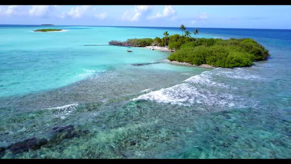 Aerial seascape of paradise coastline beach voyage by blue green lagoon and white sandy background o