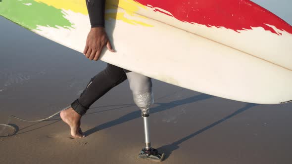 Vertical Motion of Athlete with Disability Walking Along Beach