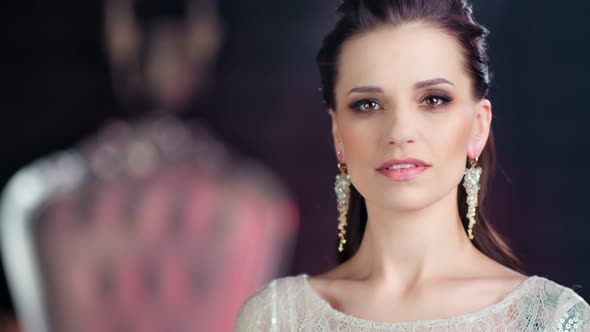 Closeup Beauty Face of Adorable Caucasian Woman with Evening Makeup Looking at Camera