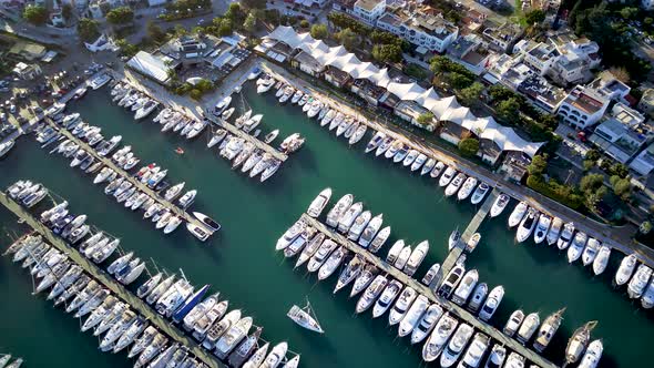 View from drone on full of yachts Bodrum harbour and ancient Kalesi castle in Mugla in Turkey