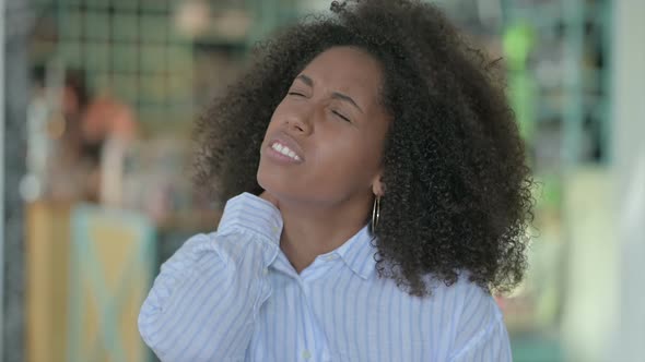 Portrait of Tired African Businesswoman Having Neck Pain