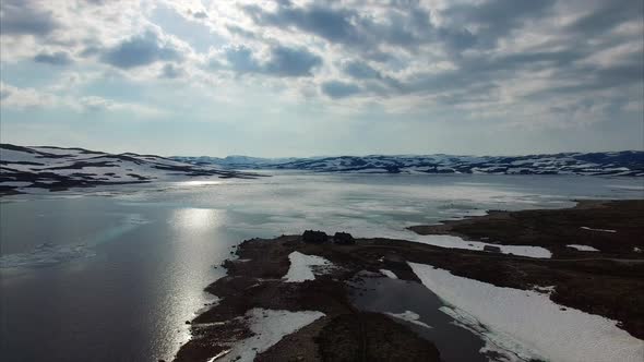 Snowy landscape of Hardangervidda mountain plateau in Norway.