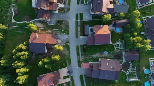 Small modern village in summer at sunset. Aerial view