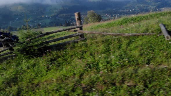 People Riding Quad Bikes on Hill