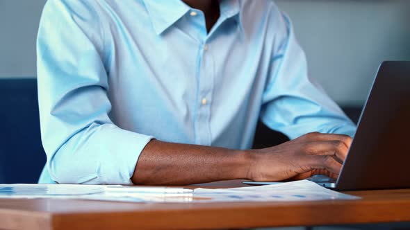 Young African American man working on laptop