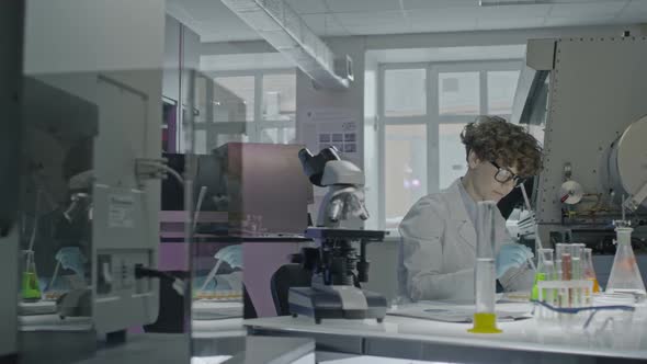 Female Scientist Working in Laboratory