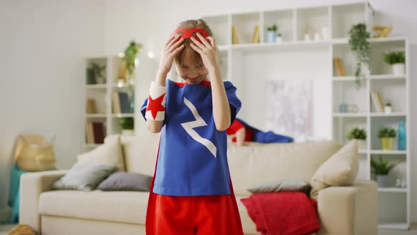 Little Girl Wearing Red Superhero Eyemask